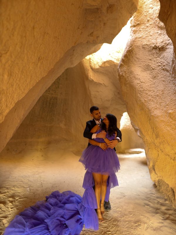 Artistic photoshoot inside natural Cappadocia rock caves